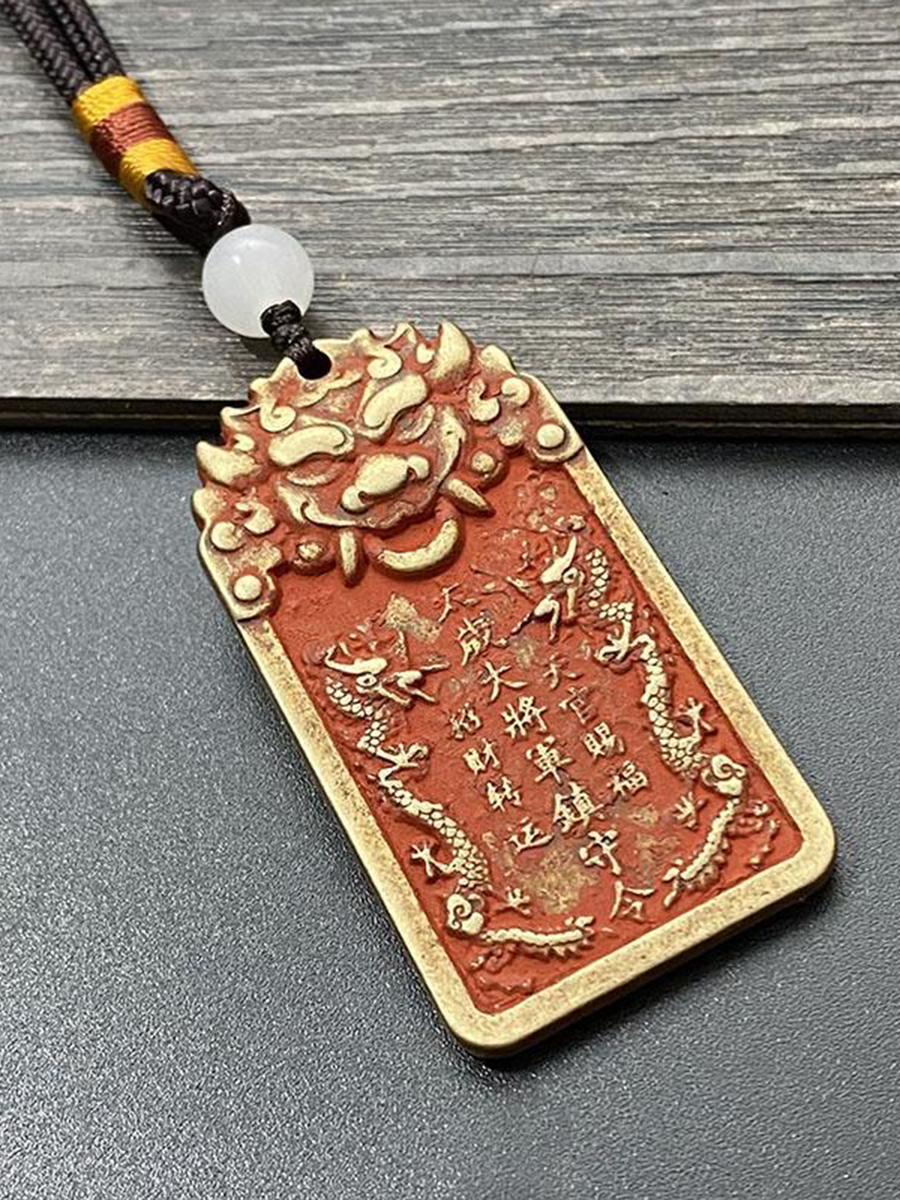 A Chinese Taoist general's tablet is displayed on a wooden board.